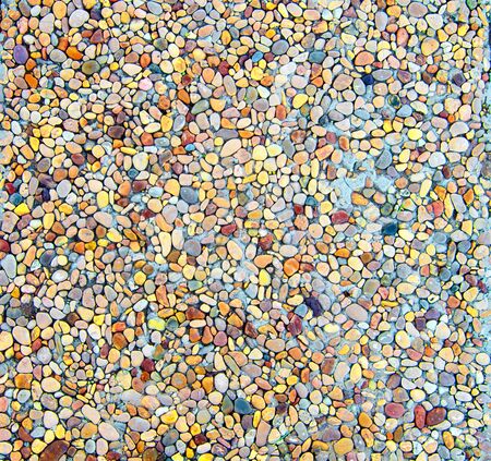 Background of Multi Colored Rounded Pebbles closeup Outdoorsの写真素材