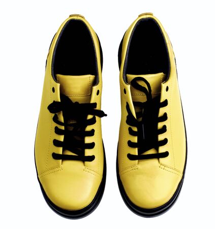 Luxury Leather Contemporary Yellow Shoes with Black Sole and Laces isolated on White background. Top Viewの写真素材
