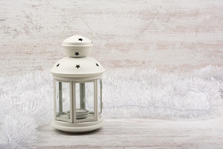 Christmas lantern on white wooden backgroundの写真素材