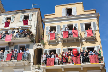 CORFU, GREECE - APRIL 30, 2016: Corfians throw clay pots from windows and balconies on Holy Saturday to celebrate the Resurrection of Christ. Easter pot smashing.のeditorial素材