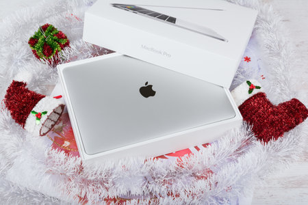 BURGAS, BULGARIA - AUGUST 31, 2017: MacBook Pro Retina Display with Touch bar and a Touch ID sensor integrated into the Power button, made by Apple Inc. Christmas gift.のeditorial素材