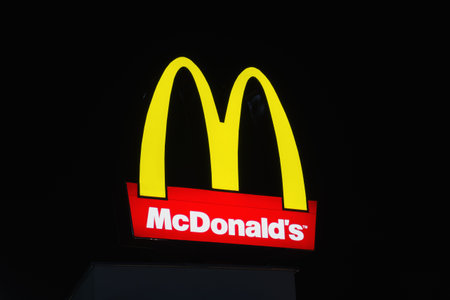 BURGAS, BULGARIA - FEBRUARY 1, 2018: McDonald's at night. McDonald's is the world's largest chain of hamburger fast food restaurants.のeditorial素材