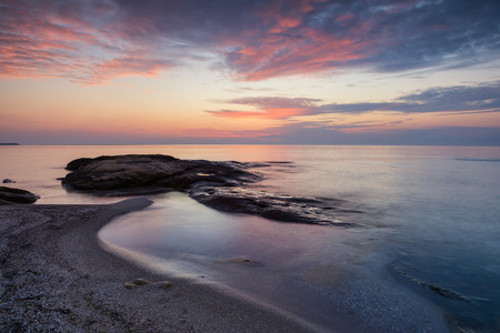 Sea sunrise at the Black Sea coast near Ravda, Bulgaria. Rocky sunrise.の写真素材
