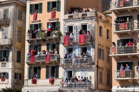 CORFU, GREECE - APRIL 7, 2018: Corfians throw clay pots from windows and balconies on Holy Saturday to celebrate the Resurrection of Christ. Easter pot smashing.のeditorial素材