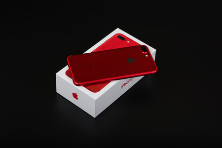 BURGAS, BULGARIA - AUGUST 7, 2018: Apple iPhone 7 Plus Red Special Edition on black background, back side.のeditorial素材