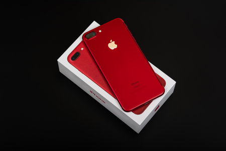 BURGAS, BULGARIA - AUGUST 9, 2018: Apple iPhone 7 Plus Red Special Edition on black background, back side.のeditorial素材