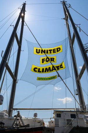 BURGAS, BULGARIA - JUNE 7, 2019: Text United For Climate on the board of Greenpeace Rainbow Warrior sailing ship at the Port of Burgas, Bulgaria.のeditorial素材
