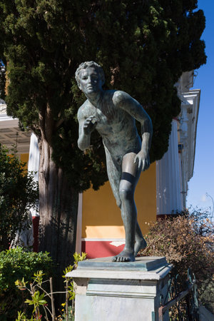 CORFU, GREECE - MARCH 4, 2017: A statue of The Runner in the garden of Achilleion palace in Corfu Island, Greece, built by Empress of Austria Elisabeth of Bavaria, also known as Sisi.のeditorial素材