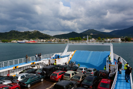 THASSOS, GREECE - APRIL 18, 2014: A ferry crossing from mainland to the island of Thassos in Greece. Cars and passengers on the deck of a ferry.のeditorial素材