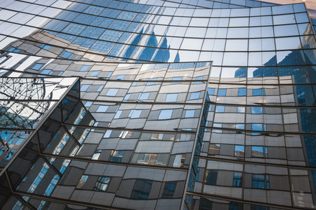 Reflection of office buildings on the glass of one of the buildings in the business center of La Defense. Paris. Franceの写真素材