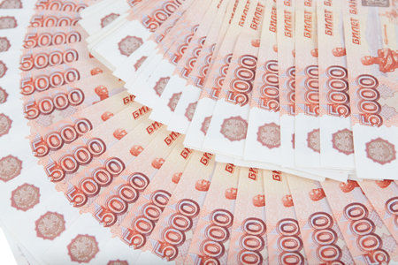 A bundle of banknotes of five thousand rubles on a white background