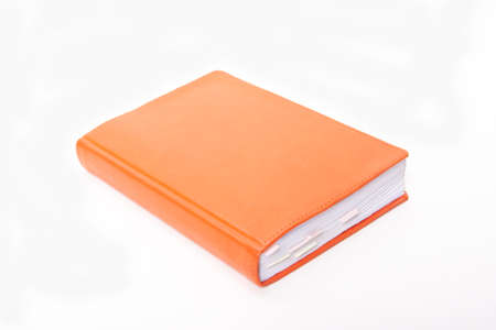 Orange notepad with bookmarks on white backgroundの写真素材