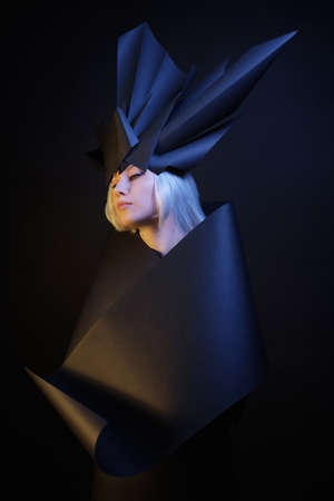 Girl blonde in black dress with black crown on the headの写真素材