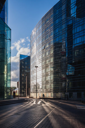 PARIS, FRANCE - APRIL, 2008: A lone bicyclist at sunset in the Paris business district of La Defense. Franceのeditorial素材