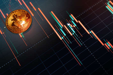 Bitcoin cryptocurrency coin on the background of the exchange chartの写真素材