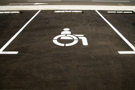 Markings on asphalt indicating a parking space for people with limited opportunities  in the cityの写真素材