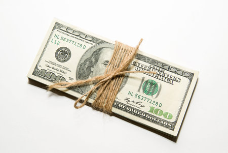 One pack of US dollars banknotes on over  white