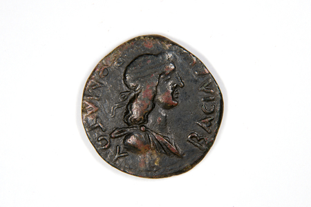 Old bronze coin with portrait of king on a white backgroundの写真素材