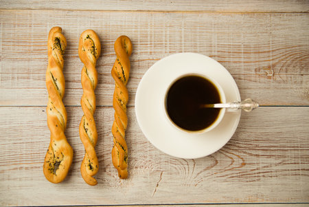 Cup of coffee and sweet buns on the table
