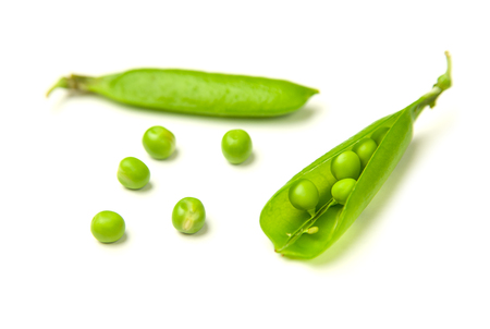 Pea pods and pea seeds on over whiteの写真素材