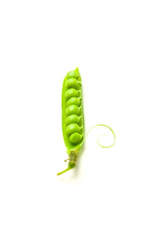 Pea pod and pea seeds on over whiteの写真素材
