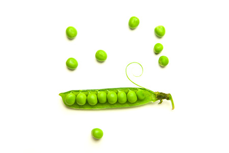 Pea pod and pea seeds on over whiteの写真素材