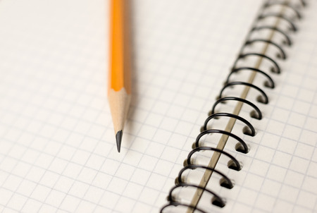 Pencil on the pages of an open notebookの写真素材