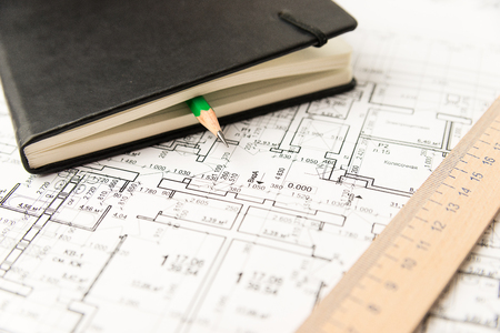 On the sheet is a pencil with Notepadの写真素材