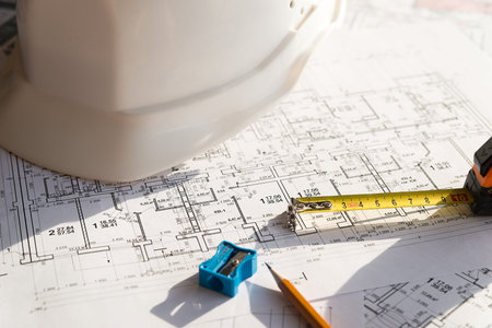 In the construction drawing are pencil, helmet and roulette