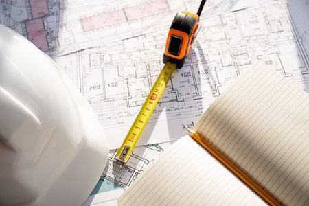 In the construction drawing are pencil, helmet and rouletteの写真素材