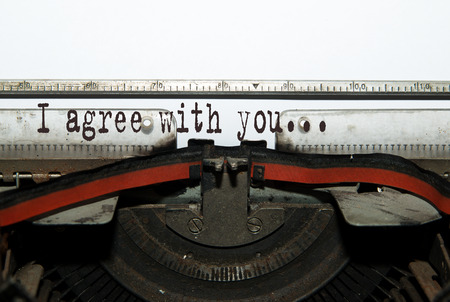 A sheet of paper is inserted into the typewriter.の写真素材