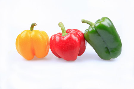 Green peppers are rich in vitamins  vitamin C  and trace elementsï¼ŒWhite backdrop 