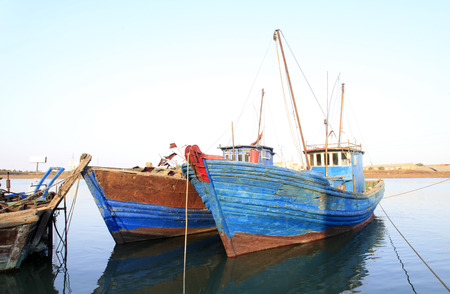 The quiet harbour, there are several stop fishing boats in the sea, very beautifulの写真素材