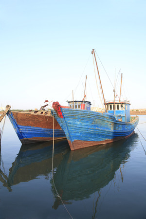 The quiet harbour, there are several stop fishing boats in the sea, very beautifulの写真素材
