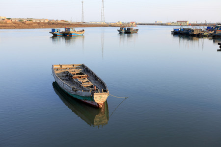 The quiet harbour, there are several stop fishing boats in the sea, very beautifulの写真素材