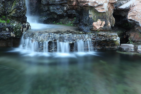 Park rockery, water, slow shutter photography, very beautifulの写真素材
