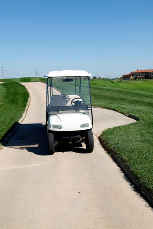 White golf carts at the green golf courseのeditorial素材