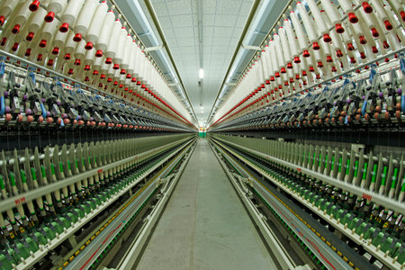 Spinning mill workshop, the workers operating Spinning equipment at workのeditorial素材