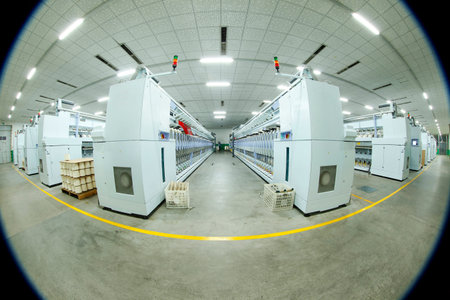 Spinning mill workshop, the workers operating Spinning equipment at workのeditorial素材