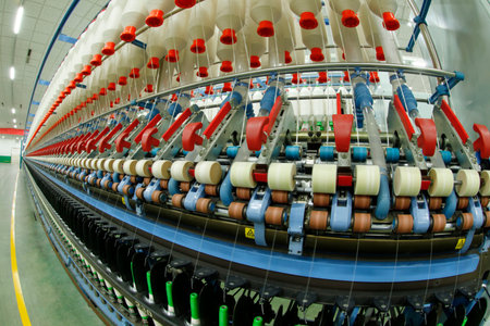Spinning mill workshop, the workers operating Spinning equipment at work
