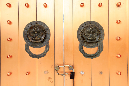 Ancient Chinese architecture copper door knocker Symbol propitious and majestyの写真素材