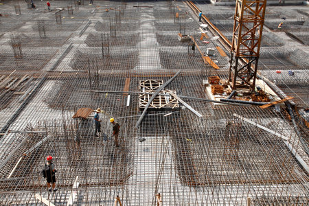 worker in the construction site making reinforcement metal framework for concrete pouringのeditorial素材