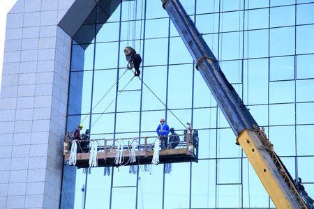 Workers wash the modern office buildingの写真素材