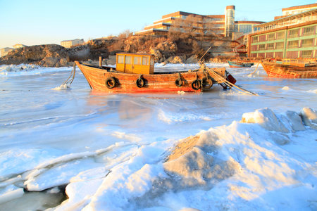 Fishing boat in the sea during winterの写真素材