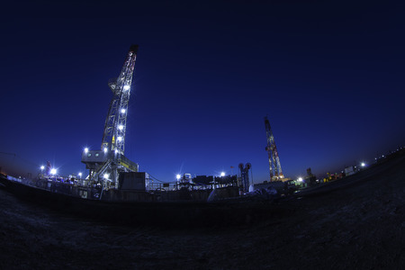 In the evening of oilfield derrickの写真素材