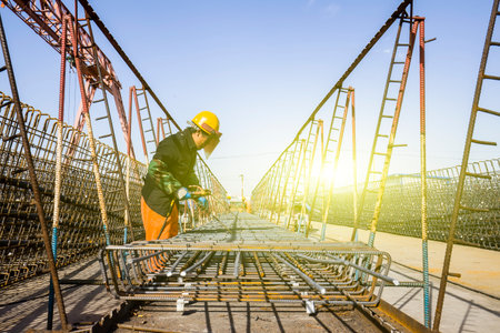 The welding workers at work at the construction siteのeditorial素材