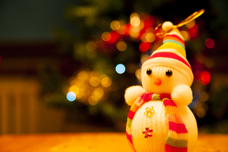 Festive snowman with Christmas light backgroundの写真素材