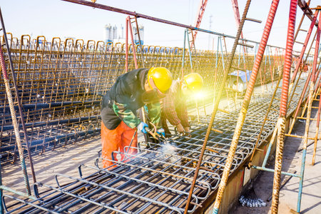Welding workers at work in a construction siteのeditorial素材