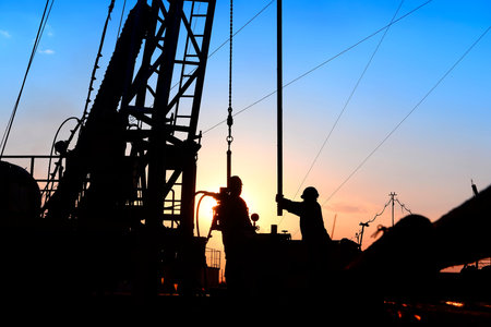 oil field, the oil workers are workingの写真素材