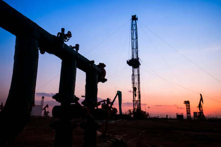 In the evening of oilfield pipeline silhouette